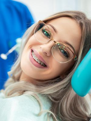 Woman with Braces in the orthodontics chair